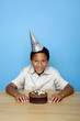 Boy posing with his birthday cake
