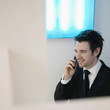A guy in suit using cell phone