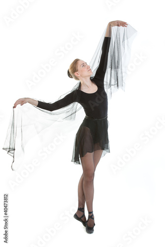 Photo: Young ballerina in black costume Young ballerina in black costume