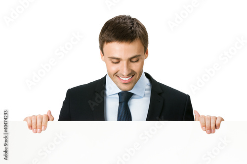 Foto: Businessman showing blank signboard, isolated Businessman showing blank signboard, isolated