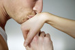 Man kissing his girlfriend's hand