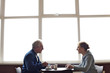 A mature couple relaxing and having coffee in a cafe