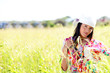 Beautiful gypsy girl with scarf standing in meadow Beautiful gypsy girl with scarf standing in meadow