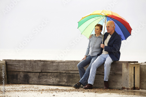 Photo: A couple sitting and enjoying the sunny weather A couple sitting and enjoying the sunny weather