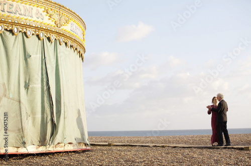 Photo: An elderly couple dancing on the beach An elderly couple dancing on the beach