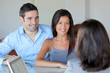 Couple meeting financial adviser for investment