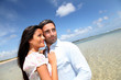 Couple of lovers embracing each other at the beach