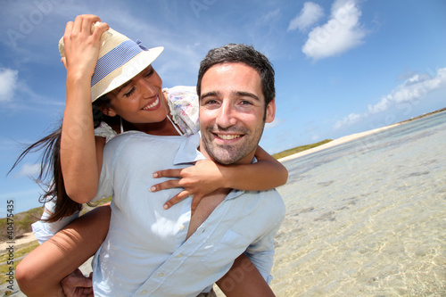 Photo: Lovers enjoying sunny day at the beach. Lovers enjoying sunny day at the beach.