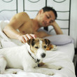 Man and dog on the bed