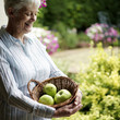 Senior woman holding a basket of fruits