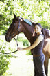 Photo : Teenage girl posing with her horse Teenage girl posing with her horse