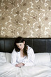 A sick woman in bed