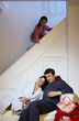 Little girl peeping from the staircase