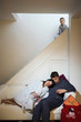 Little boy peeping from the staircase