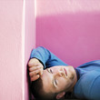 A man lying at a corner