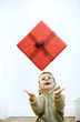 Little boy tossing his gift
