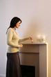 Woman lighting up candles