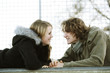 Couple lying down face to face