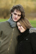 Happy couple leaning on each other