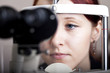 Beautiful young woman having eye test