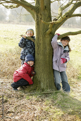 Photo: Children posing by a tree Children posing by a tree