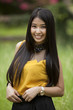 Young long hair Asia women action in a park.
