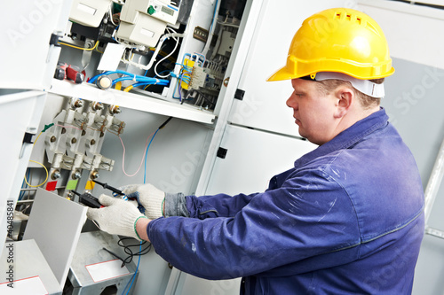 Photo: Electrician measure voltage and current Electrician measure voltage and current