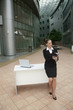 Businesswoman writing on organizer