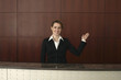 Receptionist standing at the reception counter