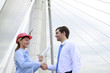 Businessman and businesswoman shaking hands