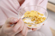 Woman holding a bowl of breakfast cereal