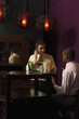 Businessmen having discussion over glasses of cocktails