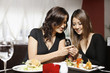 Women looking at a text message