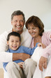 Man, woman and boy embracing