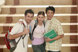 Two men and a woman posing for the camera