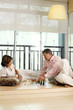 Man and woman playing chess game
