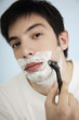 Man shaving face