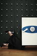 Businesswoman peering into safe