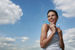 Woman holding toothbrush and toothpaste