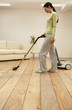 Woman vacuuming the floor