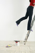 Woman climbing up ladder