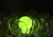 Green lightbulb among other lightbulbs