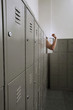Human arm coming out from a locker