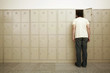 Man standing with his head in the locker
