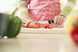 Photo: Woman cutting carrot Woman cutting carrot