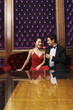 Man giving a rose to woman
