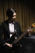 Young woman playing electric guitar