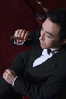 Man in tuxedo holding a cigar