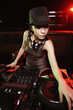 Woman spinning records on turntable