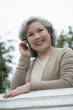 Foto: Senior woman smiling while talking on the phone Senior woman smiling while talking on the phone
